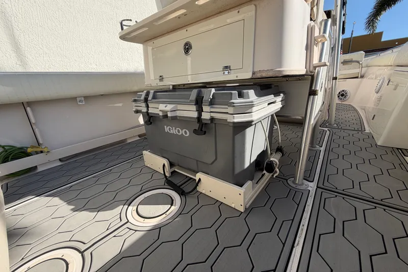 Slide: The Image of 2004 Grady White 273 boat deck with Igloo cooler and storage compartment. - 67