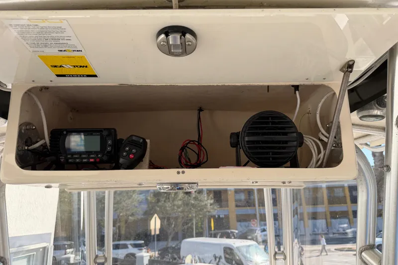 Slide: The Image of 2004 Grady White 273 boat electronics compartment with radio and speaker. - 74