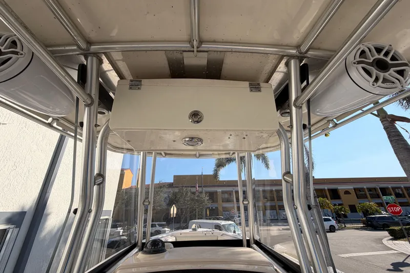 Slide: The Image of 2004 Grady White 273 boat interior with speakers and storage compartment. - 75