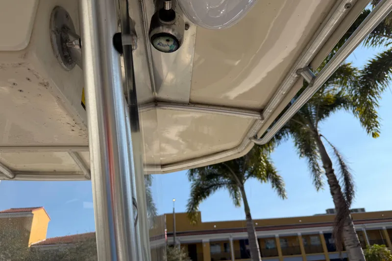 Slide: The Image of 2004 Grady White 273 boat interior with palm trees in the background. - 76