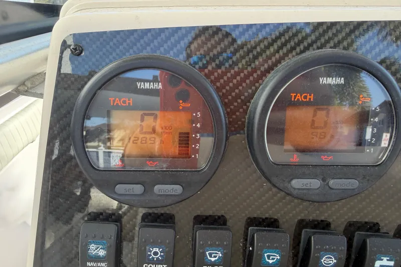Slide: The Image of Yamaha tachometer display on 2004 Grady White 273 boat dashboard. - 81