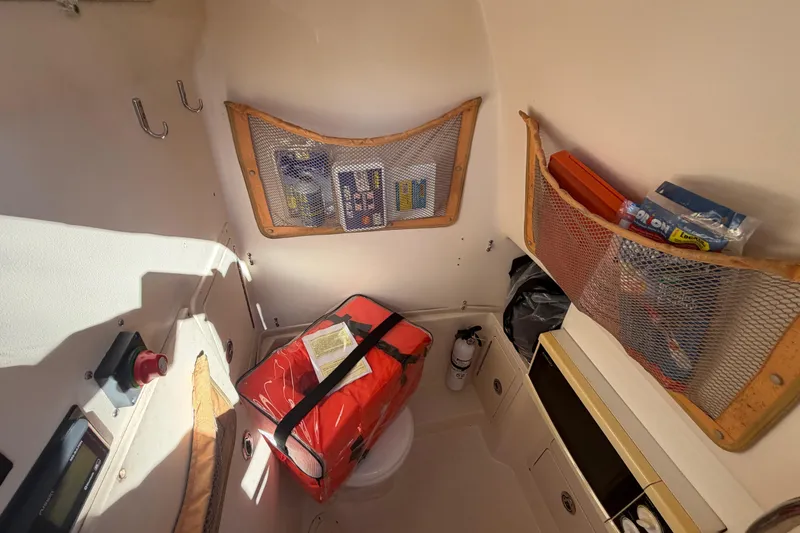 Slide: The Image of Interior of 2004 Grady White 273 boat with storage nets and safety equipment. - 86