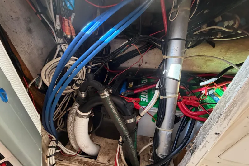 Slide: The Image of Electrical wiring and components inside a 2004 Grady White 273 boat. - 89