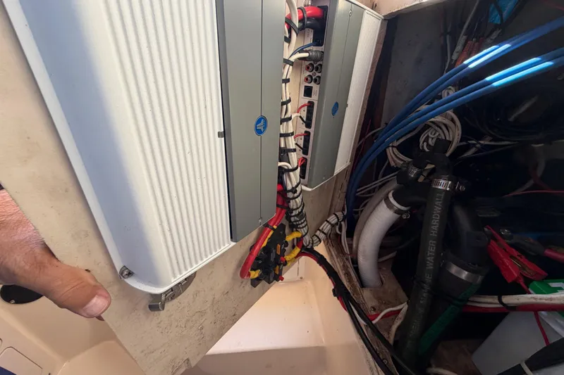 Slide: The Image of Electrical panel and wiring inside a 2004 Grady White 273 boat. - 97