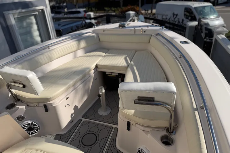 Slide: The Image of 2004 Grady White 273 boat interior with cushioned seating and modern design. - 98