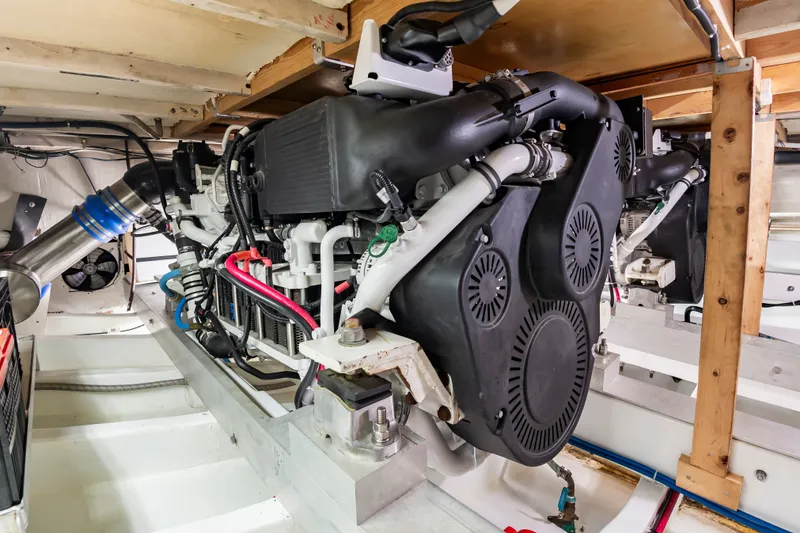 Slide: The Image of The engine room of a 2000 Custom Carolina Terry Guthrie Sportfish features a powerful engine. - 26