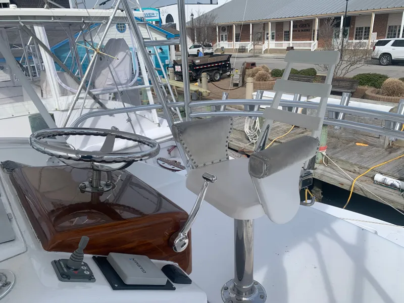 Slide: The Image of Custom Carolina Terry Guthrie Sportfish 2000 cruising on open sea. - 2