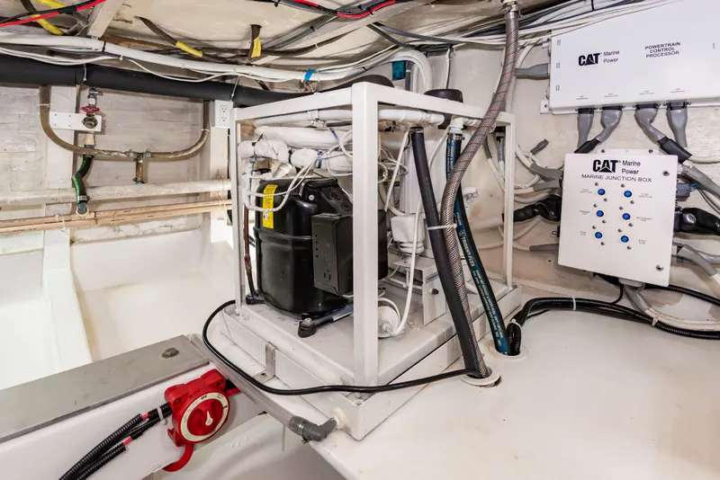 Slide: The Image of Engine room with wiring and CAT control unit, showcasing technical details of the boat. - 31