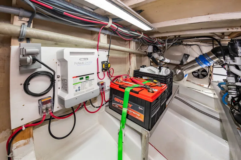Slide: The Image of Electronics and batteries in the engine room of a 2000 Custom Carolina Terry Guthrie Sportfish. - 35