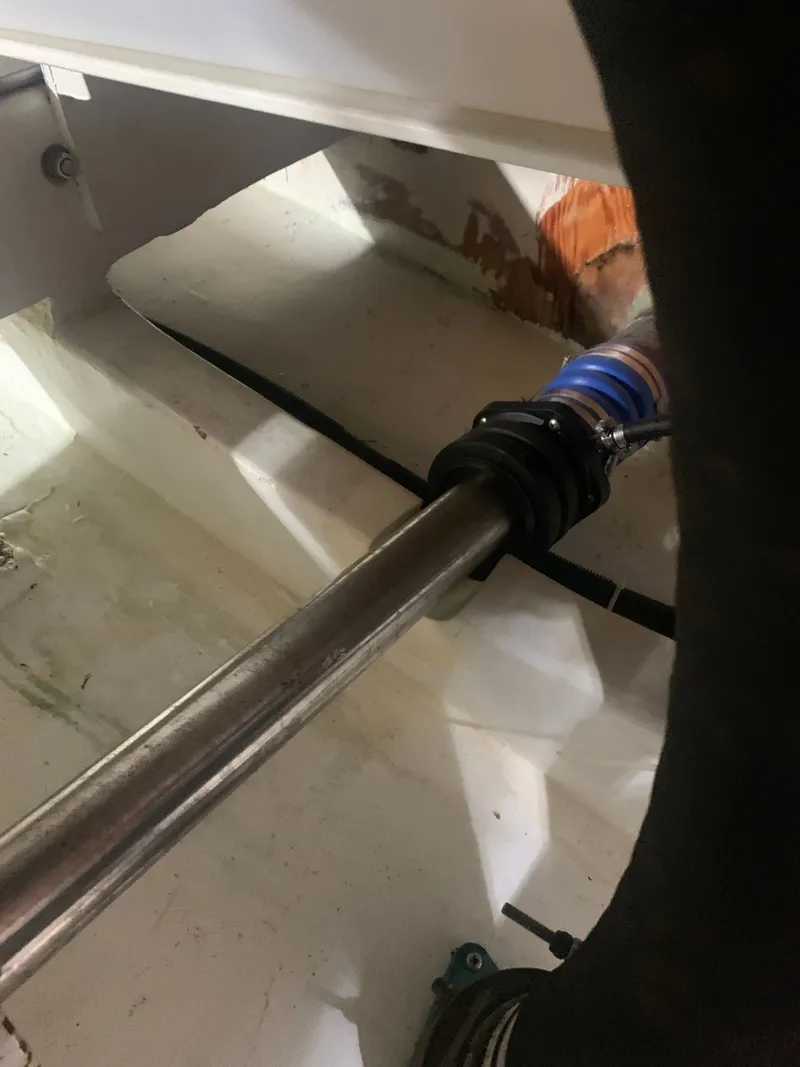 Slide: The Image of Engine room of 2000 Custom Carolina Terry Guthrie Sportfish with batteries and fire extinguisher. - 30