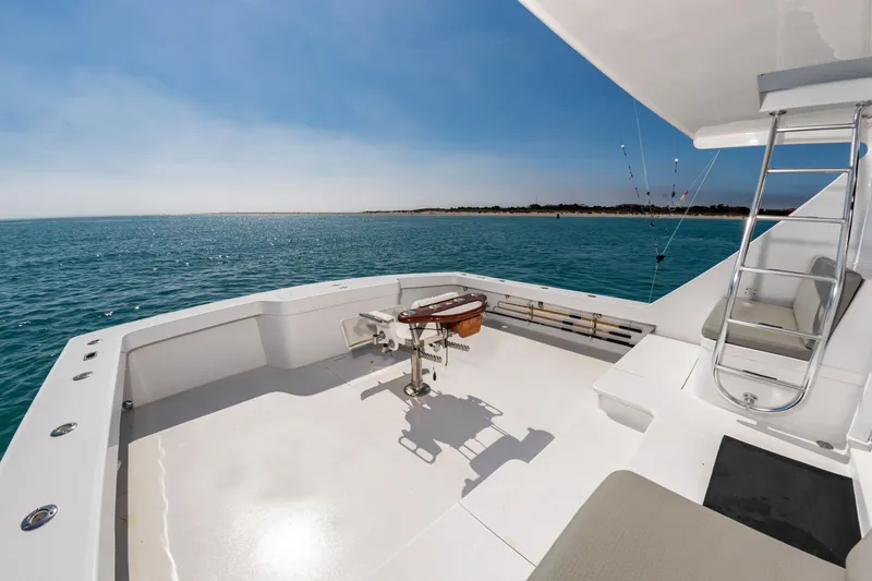 Slide: The Image of The image shows the deck of a 2000 Custom Carolina Terry Guthrie Sportfish on open water. - 9