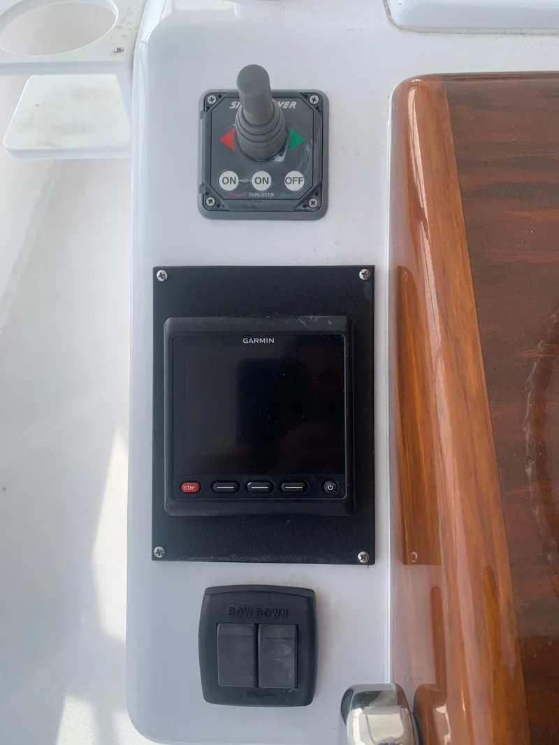 Slide: The Image of Deck of a Custom Carolina Terry Guthrie Sportfish 2000 boat on open sea. - 9