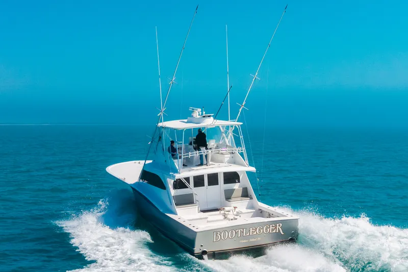 Slide: The Image of A 2000 Custom Carolina Terry Guthrie Sportfish cruising swiftly on the ocean. - 48