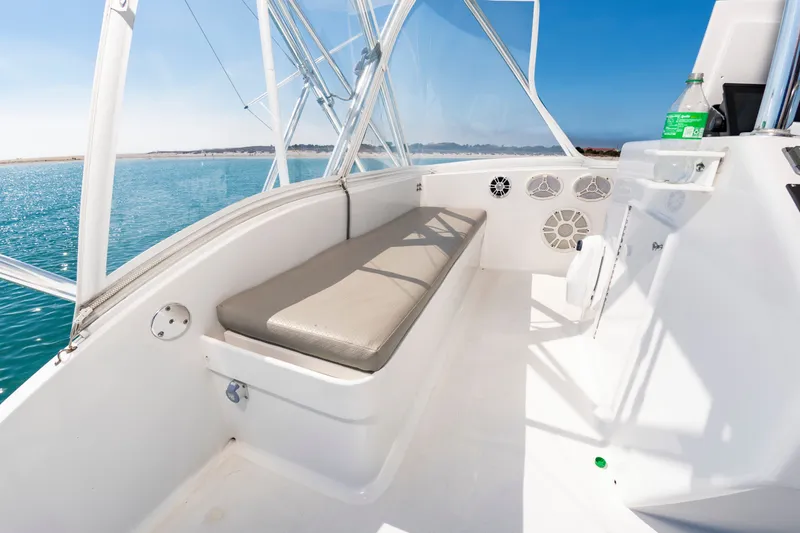 Slide: The Image of The image shows the cockpit of a 2000 Custom Carolina Terry Guthrie Sportfish with a bench seat and clear view. - 17