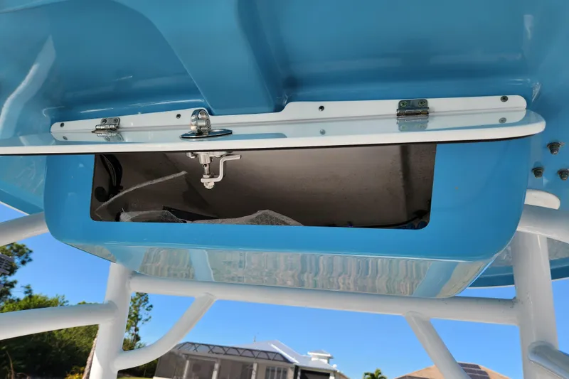 Slide: The Image of 2020 Sportsman Open 232 Center Console boat storage compartment, open and empty. - 12