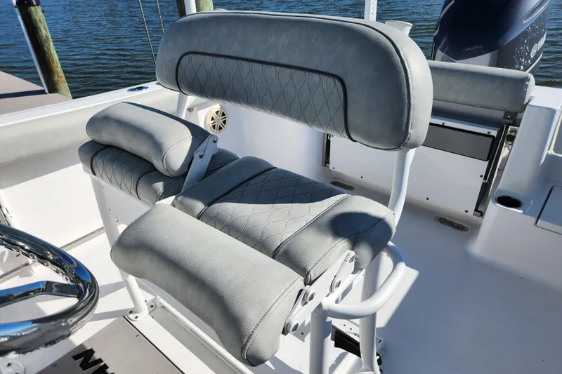 Slide: The Image of 2020 Sportsman Open 232 Center Console boat seat with gray upholstery. - 14