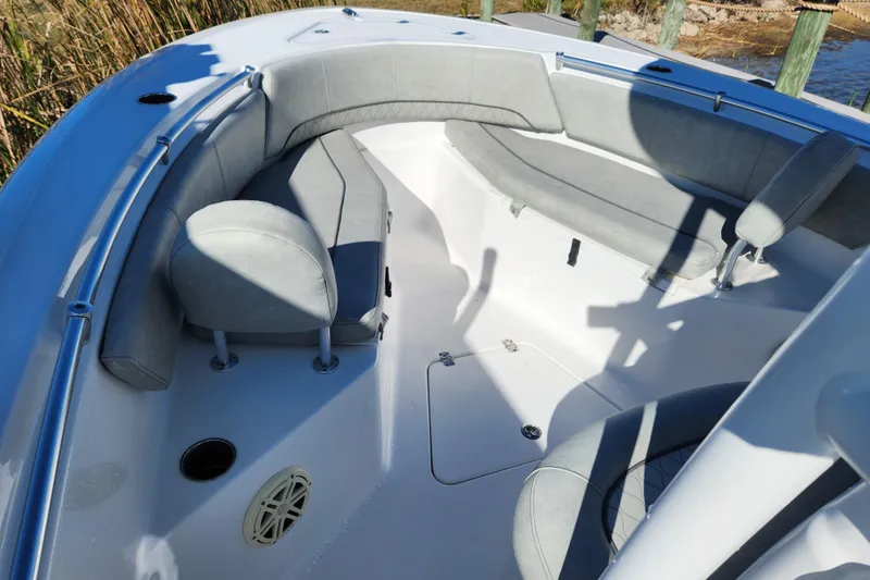 Slide: The Image of 2020 Sportsman Open 232 Center Console boat interior with cushioned seating. - 15