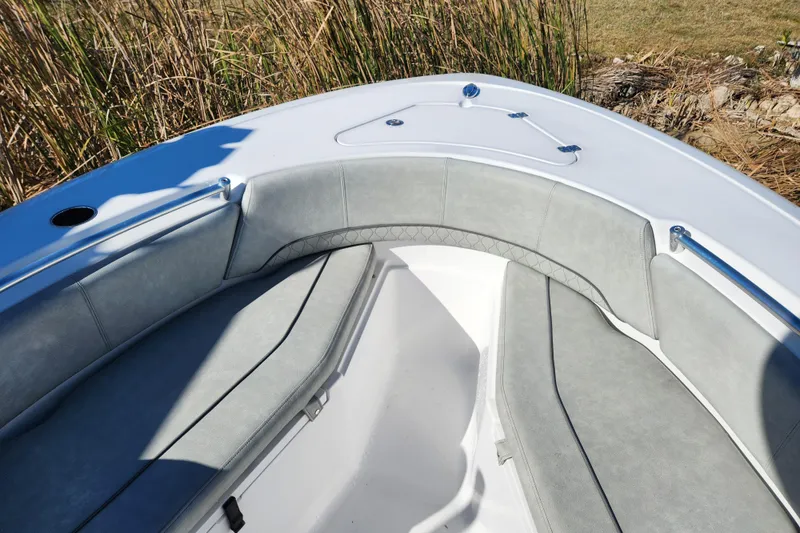 Slide: The Image of 2020 Sportsman Open 232 Center Console boat with cushioned seating and sleek design. - 17