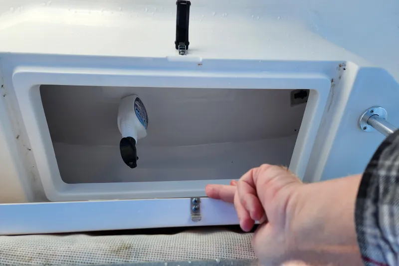 Slide: The Image of Open storage compartment on 2020 Sportsman Open 232 Center Console boat. - 20