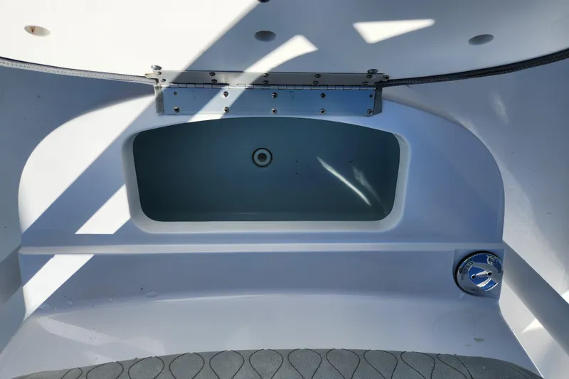 Slide: The Image of 2020 Sportsman Open 232 Center Console boat interior storage compartment. - 23