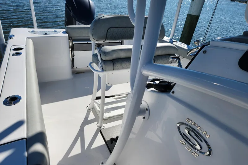 Slide: The Image of 2020 Sportsman Open 232 Center Console boat interior with seating and ocean view. - 24