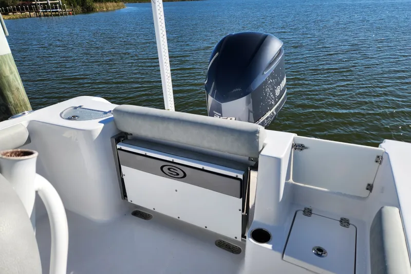 Slide: The Image of 2020 Sportsman Open 232 Center Console boat with Yamaha outboard motor on calm water. - 26