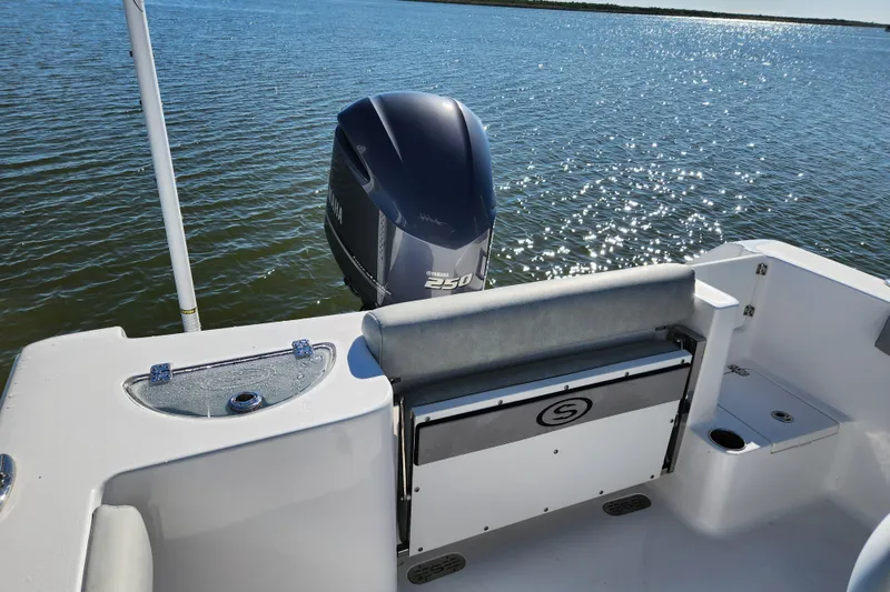 Slide: The Image of 2020 Sportsman Open 232 Center Console boat with Yamaha 250 engine on calm water. - 27