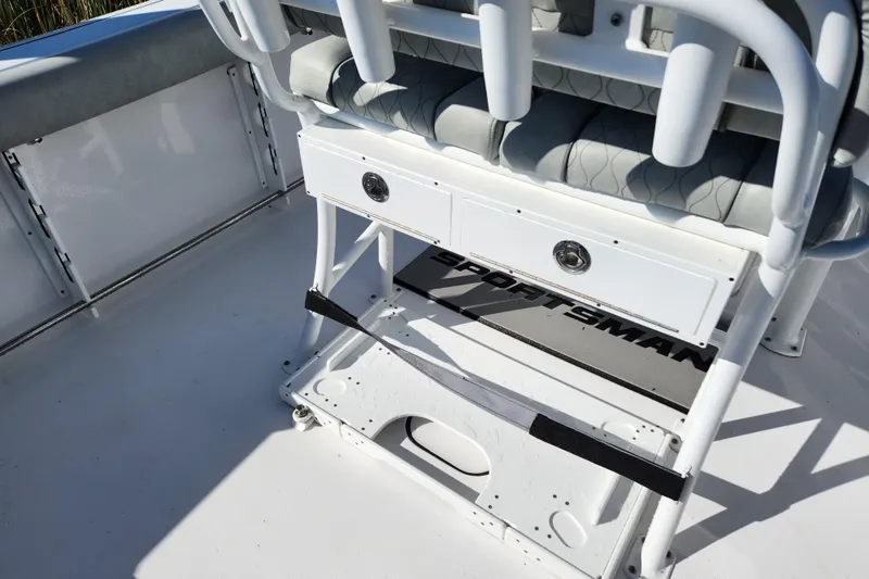 Slide: The Image of 2020 Sportsman Open 232 Center Console boat interior with seating and storage. - 5