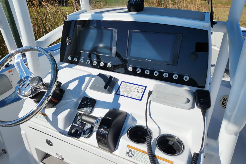Slide: The Image of 2020 Sportsman Open 232 Center Console dashboard with steering wheel and navigation screens. - 6