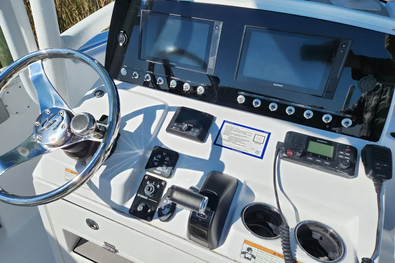 Slide: The Image of 2020 Sportsman Open 232 Center Console dashboard with steering wheel and navigation equipment. - 8