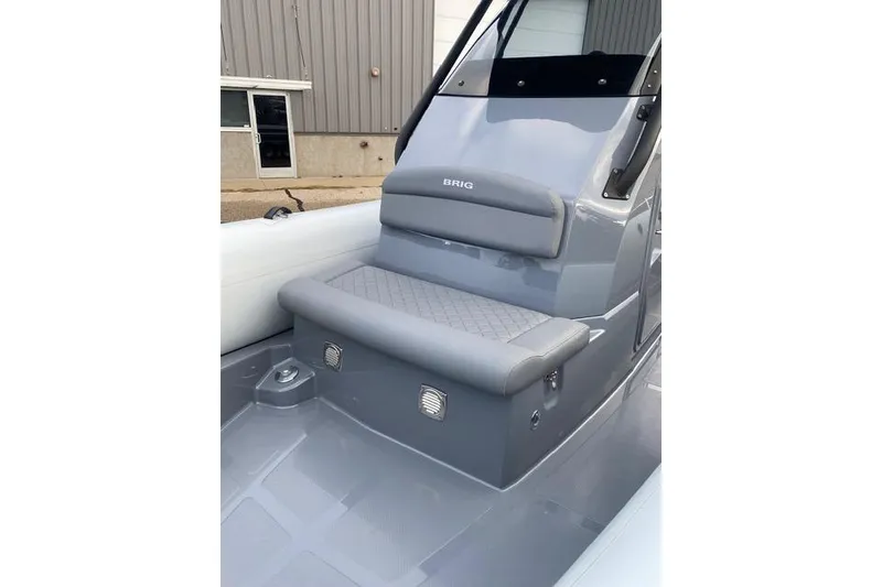 Slide: The Image of 2026 Brig Eagle 8 boat interior with gray seating and modern design. - 4