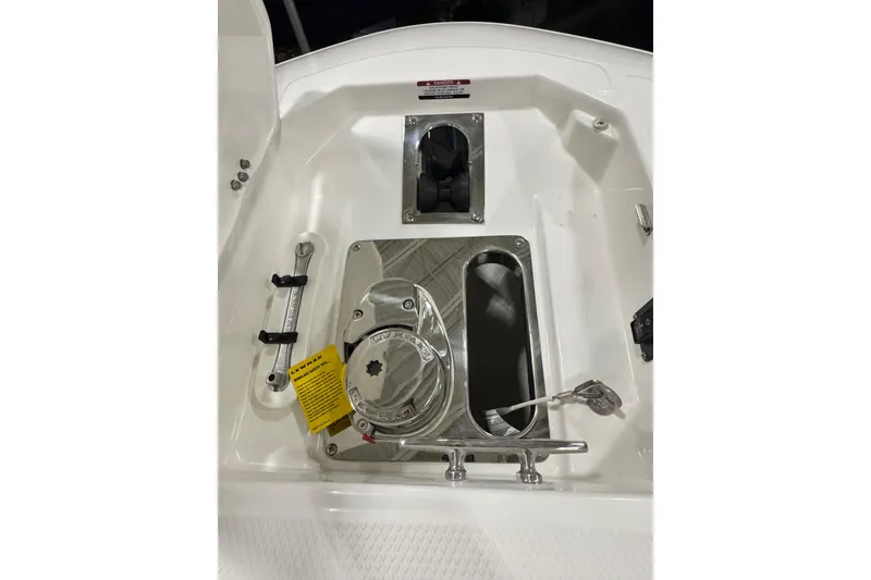 Slide: The Image of 2026 Robalo R257 Dual Console boat deck with stainless steel fittings and hatch. - 16