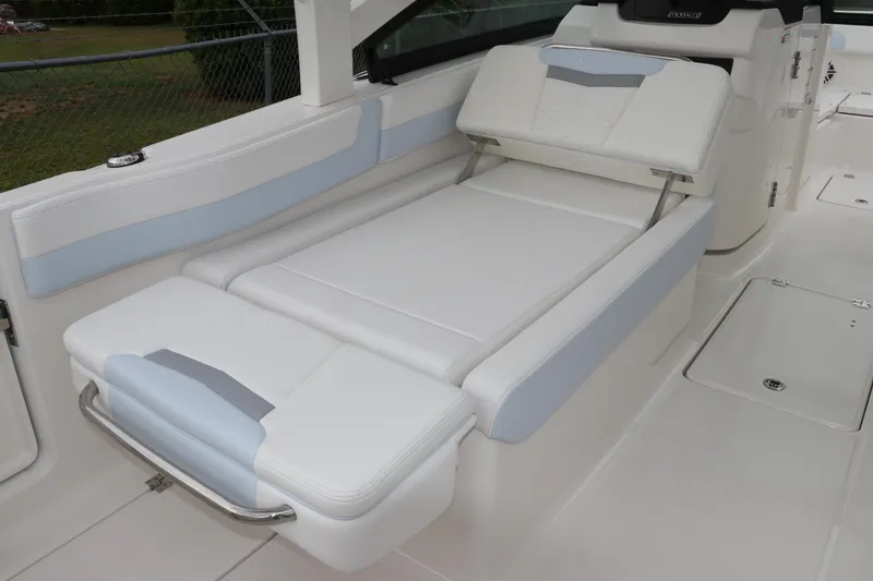 Slide: The Image of 2026 Robalo R257 Dual Console boat with open storage drawer. - 18