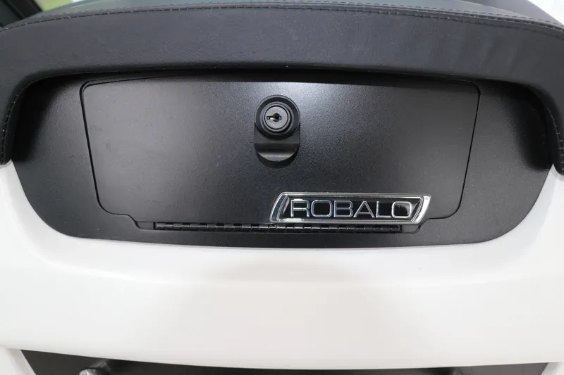 Slide: The Image of 2026 Robalo R257 Dual Console interior with white seating and modern design. - 20
