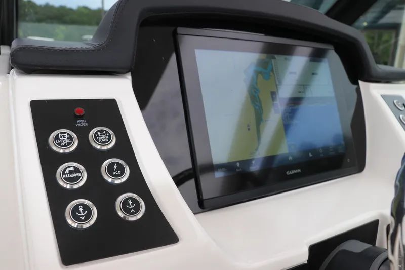 Slide: The Image of 2026 Robalo R257 Dual Console boat with JL Audio speaker and storage compartment. - 30