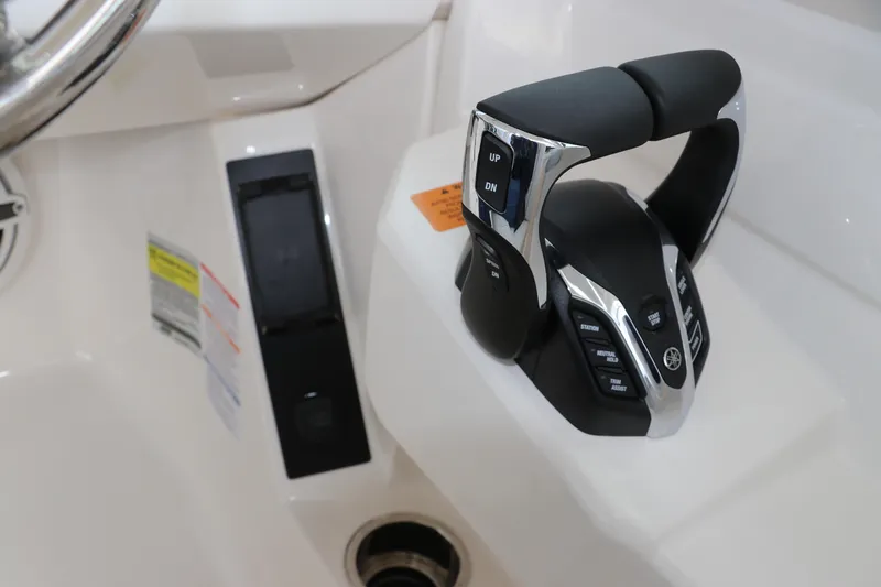 Slide: The Image of 2026 Robalo R257 Dual Console dashboard with Garmin display and control buttons. - 34