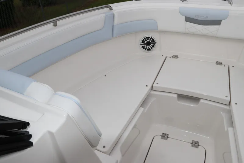 Slide: The Image of Storage compartment with black bin in 2026 Robalo R257 Dual Console boat. - 44