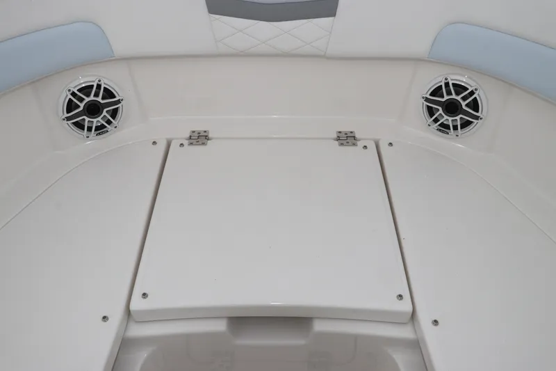 Slide: The Image of Interior of 2026 Robalo R257 Dual Console with white upholstery. - 49