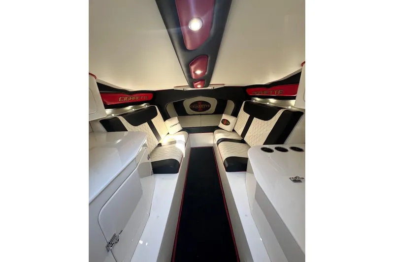 Slide: The Image of Luxurious interior of a 2018 Cigarette 42X boat with elegant seating and ambient lighting. - 13