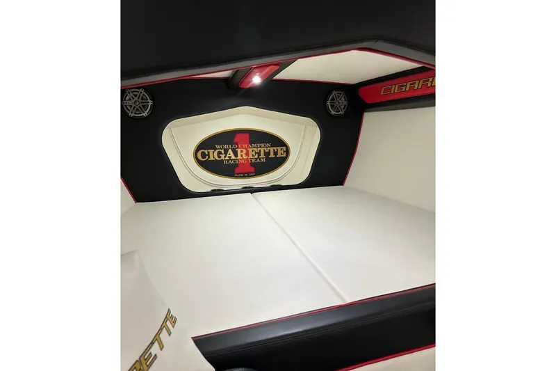 Slide: The Image of Interior of 2018 Cigarette 42X boat, featuring sleek white and black design with logo. - 14