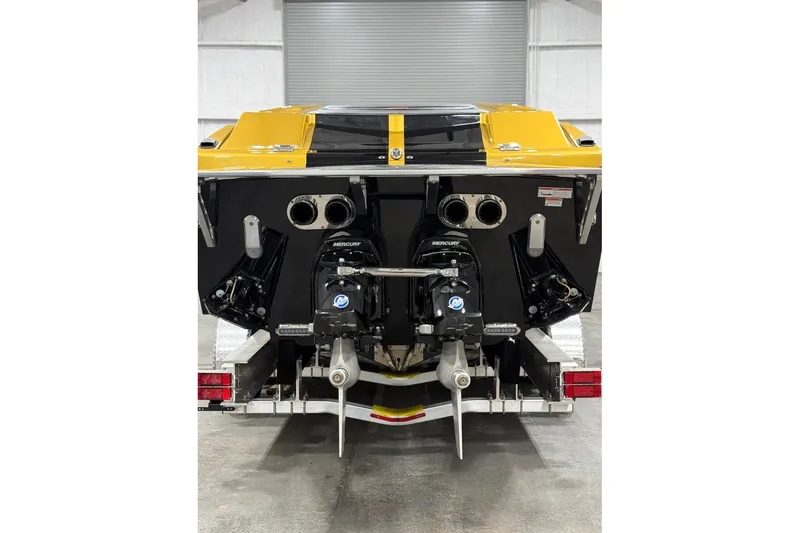 Slide: The Image of 2018 Cigarette 42X boat with dual Mercury engines, yellow and black design. - 19