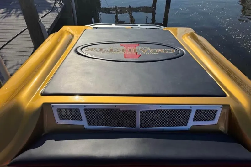 Slide: The Image of 2018 Cigarette 42X boat engine cover with logo, dockside view. - 21