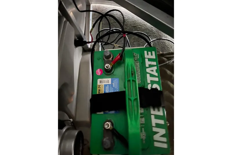 Slide: The Image of Battery setup in 2020 Tahoe Pontoon Sport Cruise Rear Bench 18' boat. - 16