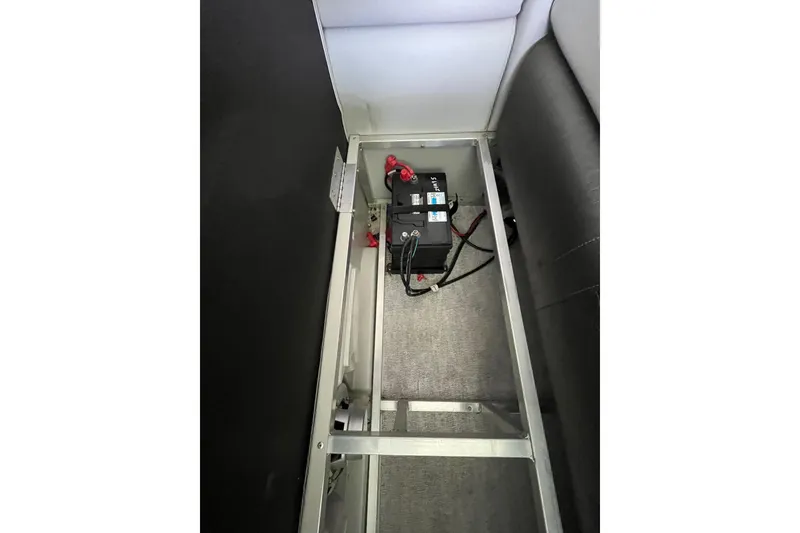 Slide: The Image of Battery compartment of 2020 Tahoe Pontoon Sport Cruise Rear Bench 18' boat. - 17