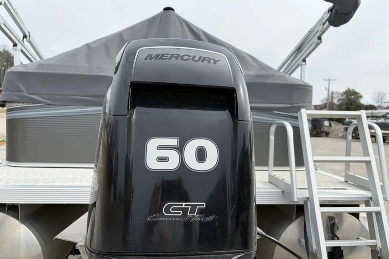 Slide: The Image of 2020 Tahoe Pontoon Sport Cruise with Mercury 60 HP engine, rear view. - 2