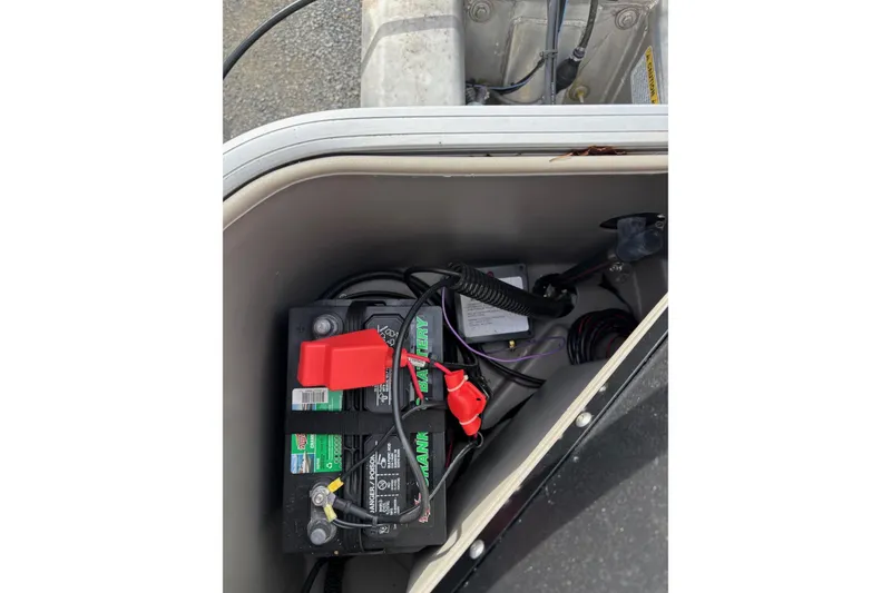 Slide: The Image of Battery compartment of 2022 Sun Tracker Bass Buggy 18 DLX boat. - 18