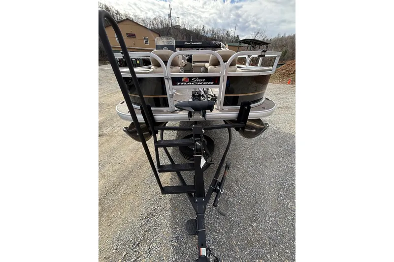 Slide: The Image of 2022 Sun Tracker Bass Buggy 18 DLX pontoon boat on trailer, rear view. - 7