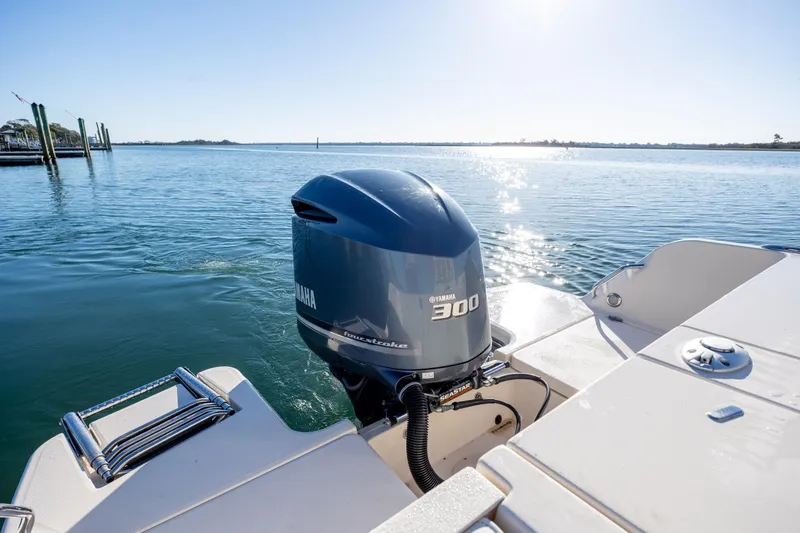 Slide: The Image of 2018 Grady-White Fisherman 236 with Yamaha 300 engine on calm water. - 10