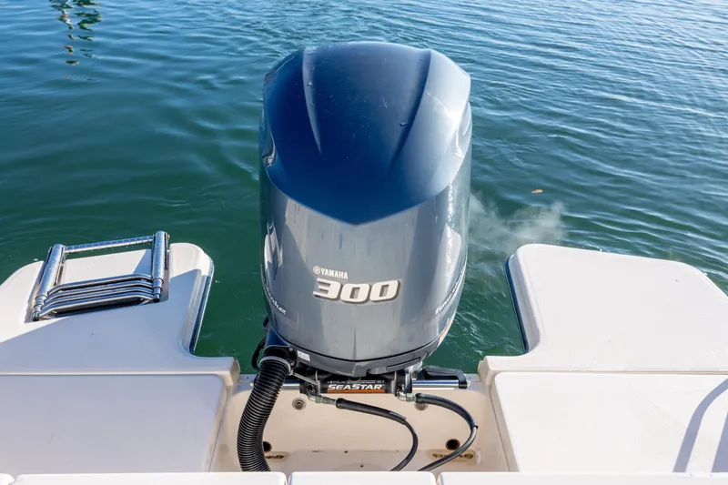 Slide: The Image of Yamaha 300 outboard motor on 2018 Grady-White Fisherman 236 boat, docked on water. - 11