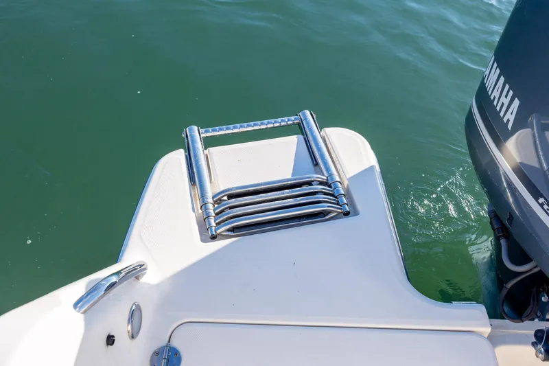Slide: The Image of 2018 Grady-White Fisherman 236 boat with Yamaha engine and folded swim ladder. - 12